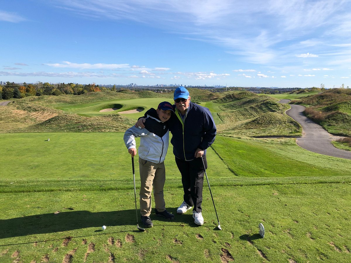 Historic depiction of Old Tom Morris working on a greens reconstruction at a links course