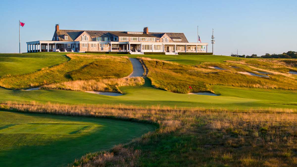 Cluster of deep, penal bunkers with steep faces casting shadows that emphasize their severity
