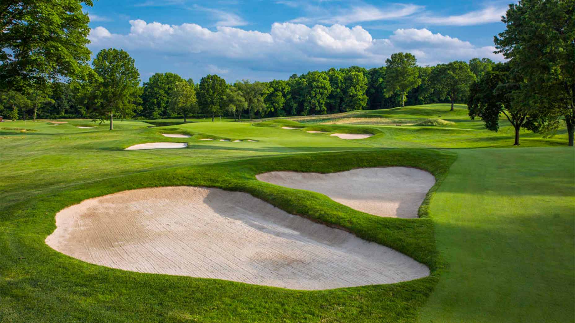 Aerial view of Winged Foot West Course showing fairways, bunkers, and surrounding landscape